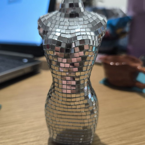 Decorative light reflection sculpture in female body shape like new