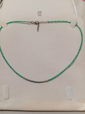 Oxette necklace used with small green stones and metal details