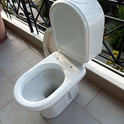 Toilet bowl with cistern like new, siphon outlet to wall