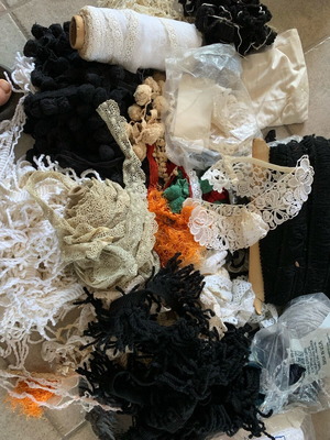 Set of threads, lace and ribbons for sewing used