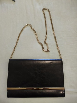 Black clutch bag with gold chain used, synthetic leather