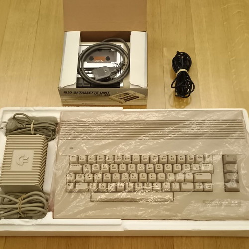 Commodore 64C used with original power supply, cassette player, and manuals