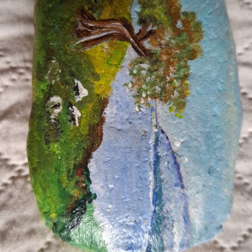 Hand-painted stone with landscape