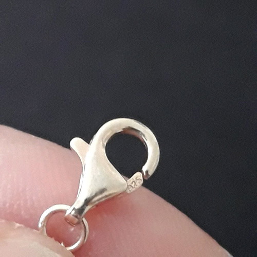 Silver set used with ring and black bracelet