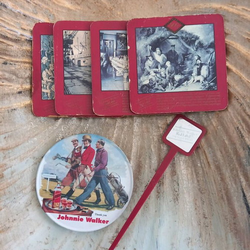 Johnnie Walker collectible set like new with 5 coasters and stirrer