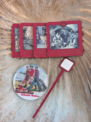 Johnnie Walker collectible set like new with 5 coasters and stirrer