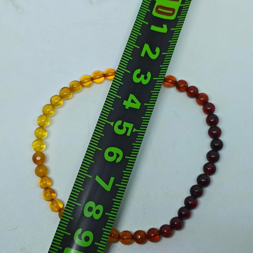 Handmade bracelet from natural amber with color gradient like new