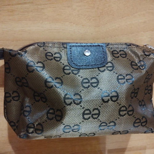 Mini toiletry set with brown-gold cosmetic bag, Apivita soap, Versace Eros Pour Femme sample