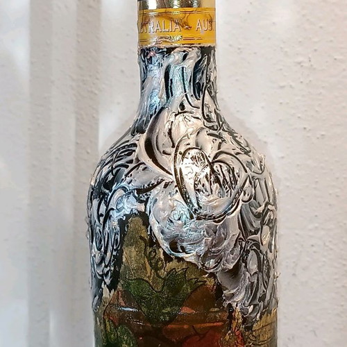 Painted wine bottle used for design