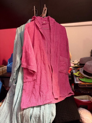 Bathrobes used, pink with hood and blue