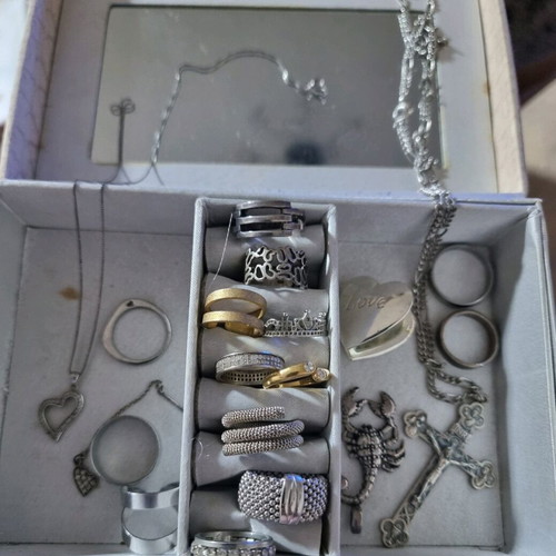 Jewelry box with various used rings and pendants