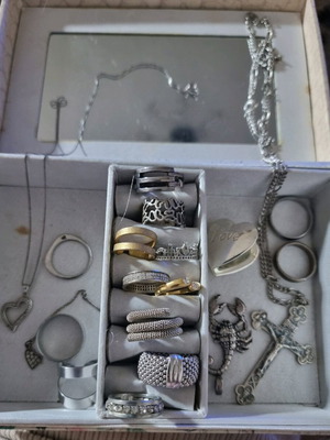 Jewelry box with various used rings and pendants