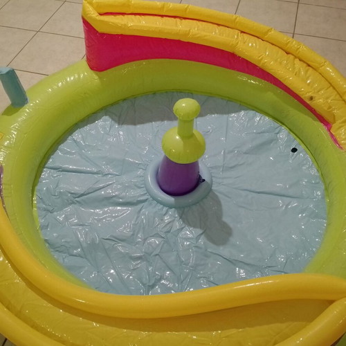 Inflatable colorful playpen used with balls and slides