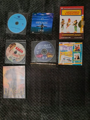Pack of 8 DVDs used with minor scratches, playable