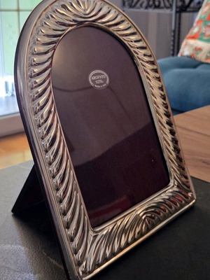 Silver photo frame used with metal wear