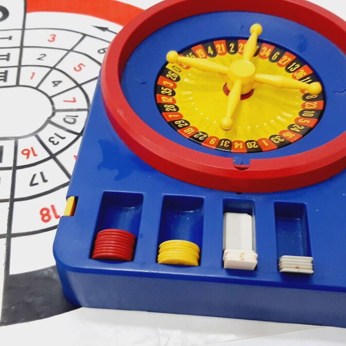 Vintage children's roulette game, like new, blue plastic, nylon mat