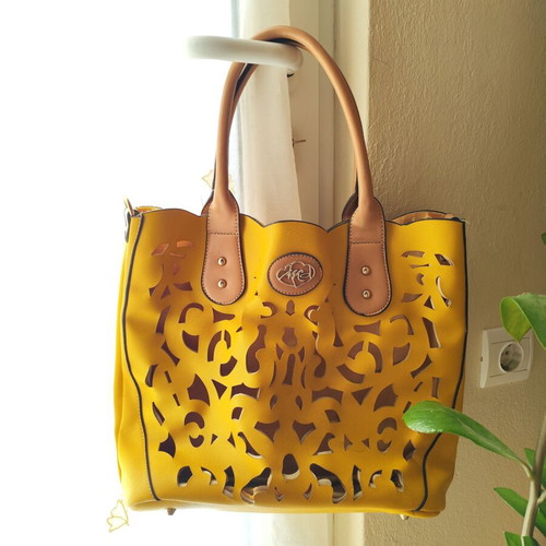 Yellow handbag used with beige details