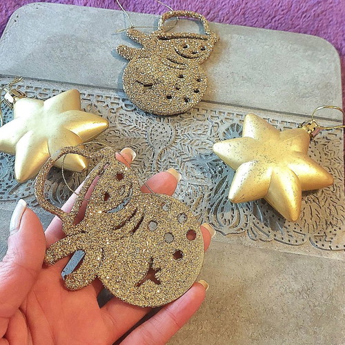 Set of gold Christmas decorations, stars and snowmen