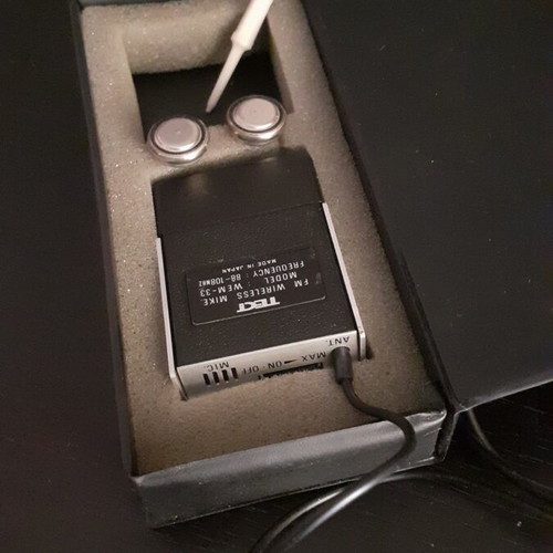Wireless FM microphone used with case and prospectus
