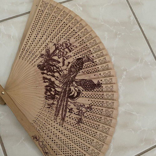 Vintage wooden hand fan used with bird designs