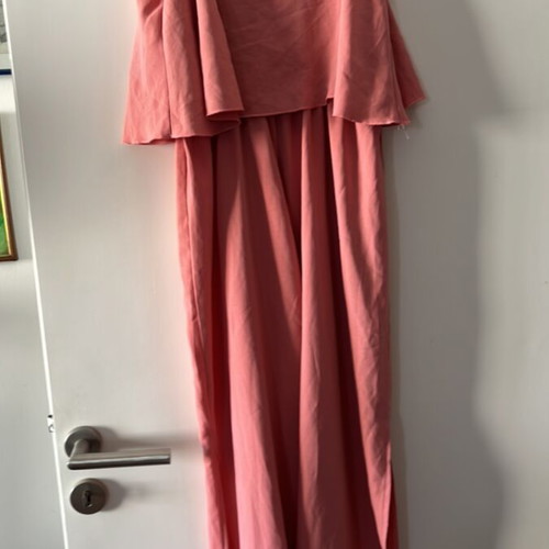 One-piece jumpsuit size S, like new, with ruffles and side openings