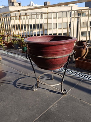 Large glazed ceramic flowerpot with decorative iron stand, like new