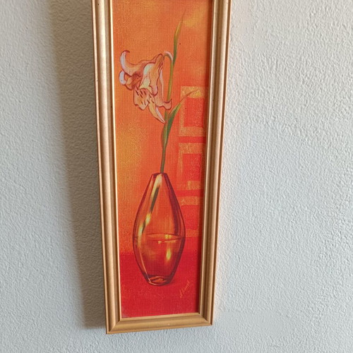 Decorative framed canvas print used, flower in glass vase