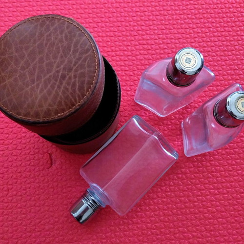 Flask with leather case like new and three bottles