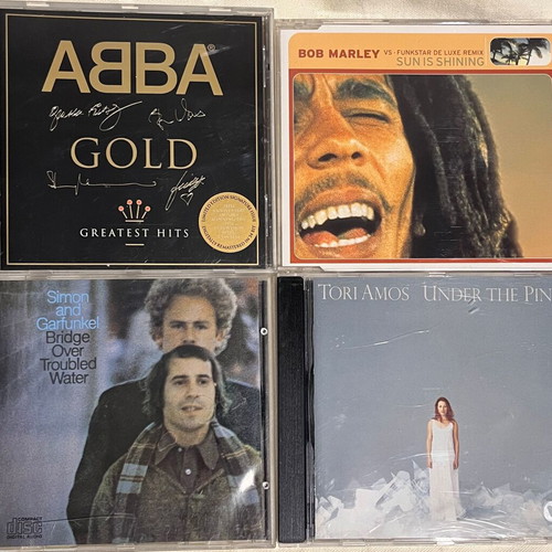 Pack of 4 used CDs with ABBA Gold, Simon & Garfunkel, Tori Amos