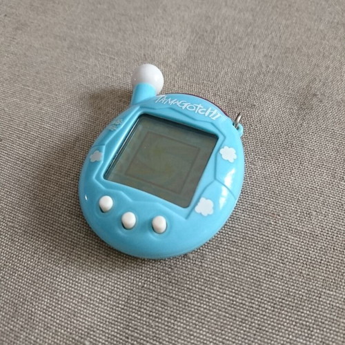 Tamagotchi Connection V4 blue used with cloud pattern