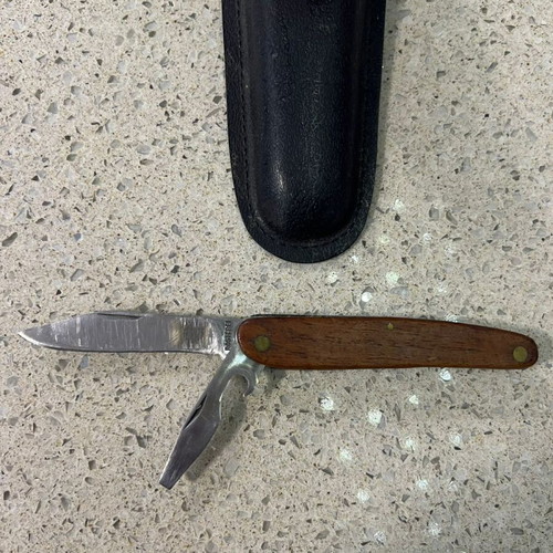Folding knife used from 1980s with sheath