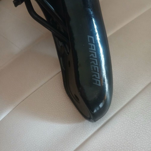 Carrera bicycle saddle like new with integrated rail clamp black