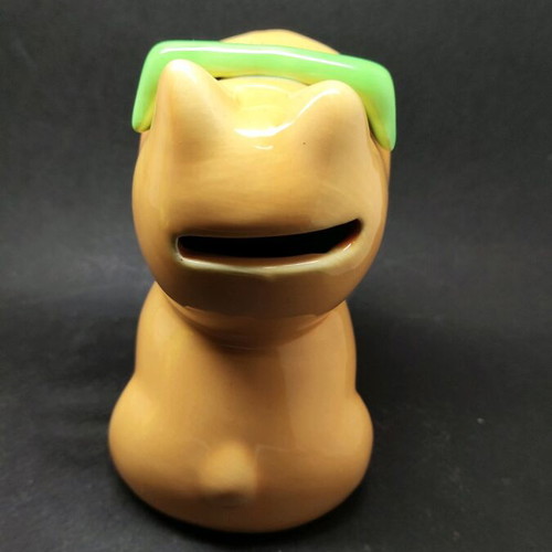 Ceramic dog piggy bank used, orange with sunglasses