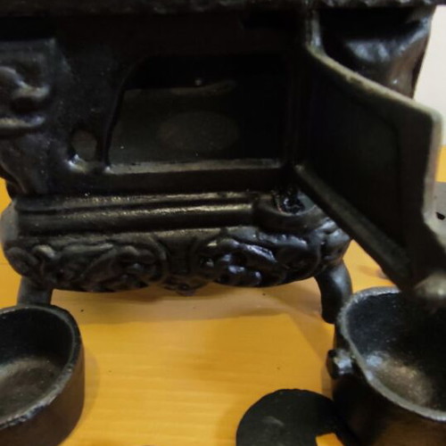 Miniature wooden stove with cast iron accessories like new