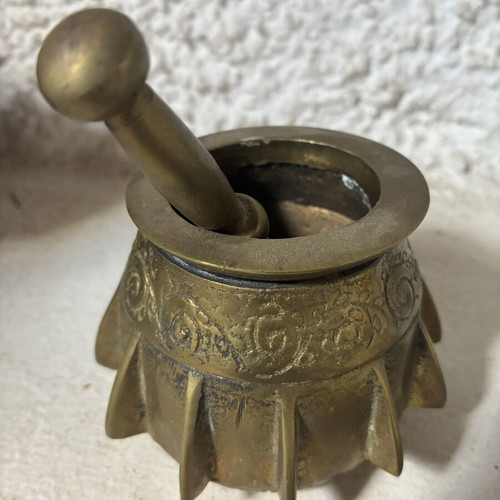 Bronze mortar and pestle used, antique with ribs and engraved design