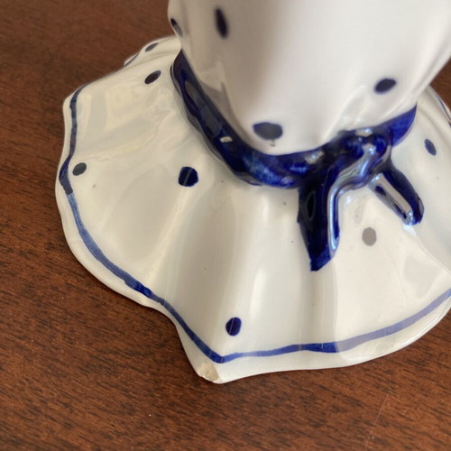 Vintage porcelain candlestick with blue bows and dots, used, damaged