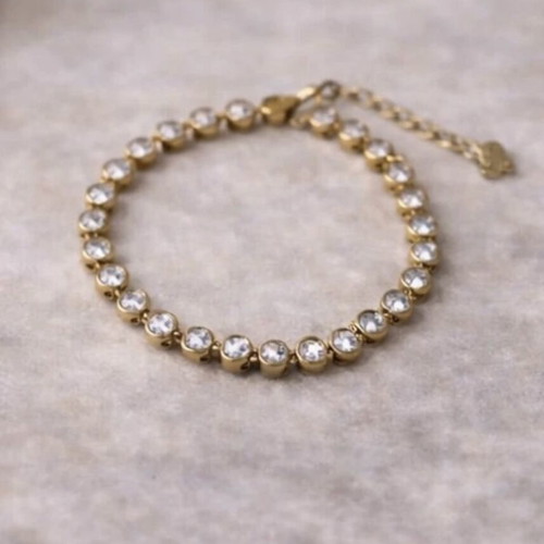 Gold bracelet with white stones like new
