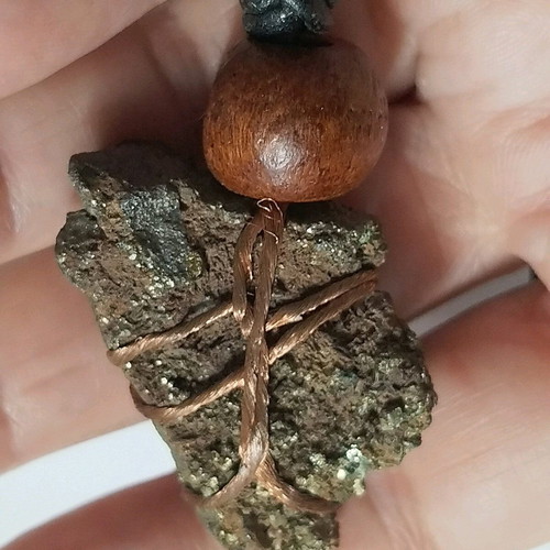 Pendant with pyrite new, gold copper wire and leather