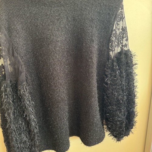 Knitted blouse like new with metallic thread and lace sleeves black