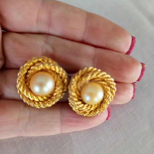 Vintage clip-on earrings used with gold embossed design and white pearl