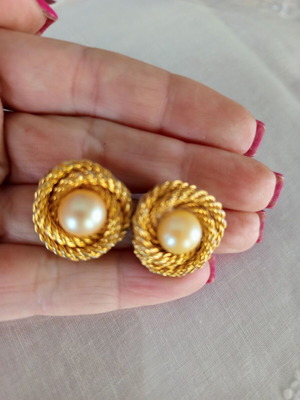 Vintage clip-on earrings used with gold embossed design and white pearl