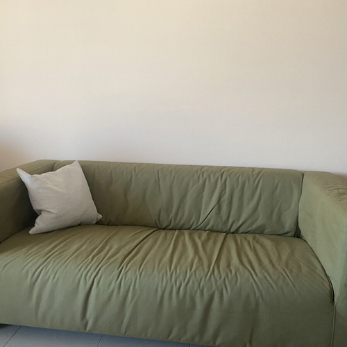 Two-seater sofa with khaki cover