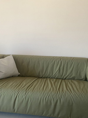 Two-seater sofa with khaki cover