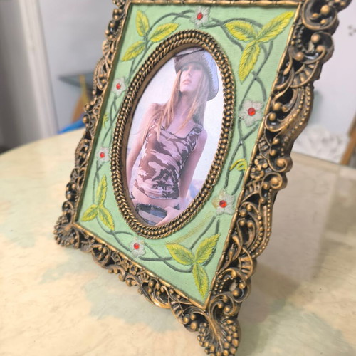 Vintage photo frame with oval opening and embossed design like new