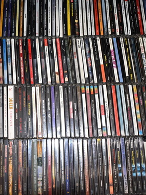 Music collection of 360 rock, pop, metal CDs, 29 music DVDs, 2 VHS tapes, with 2 CD shelves