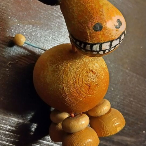 Old wooden toys like new, handmade spinning top and wooden animal