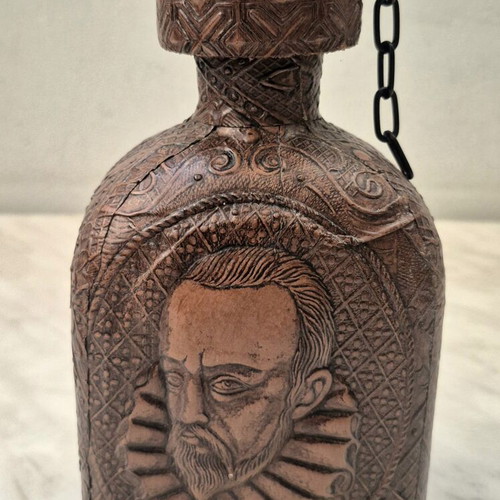 Vintage glass bottle with embossed leather Cervantes & Don Quixote