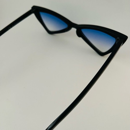 Glasses with blue triangular lens used, black frame
