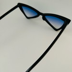 Glasses with blue triangular lens used, black frame
