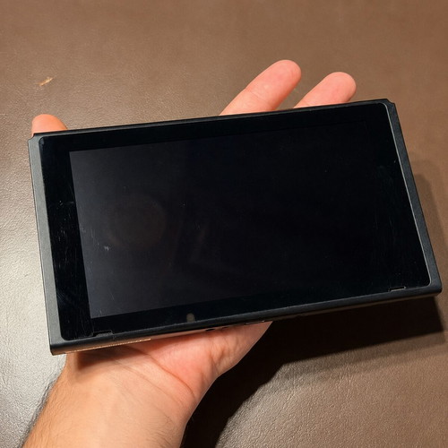 Nintendo Switch V2 console with 128GB SD card and charger